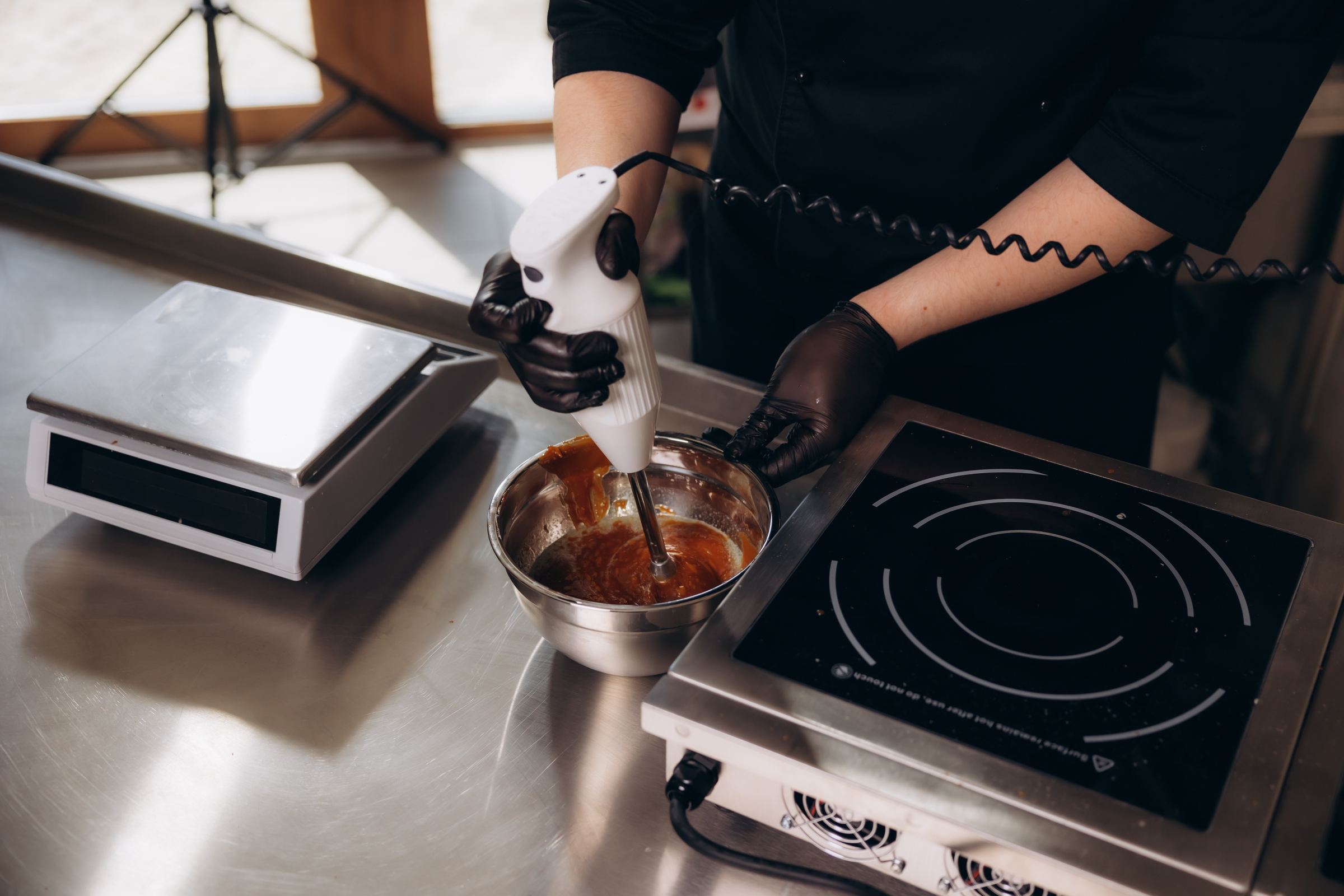 Hand-blending a fresh batch of caramel