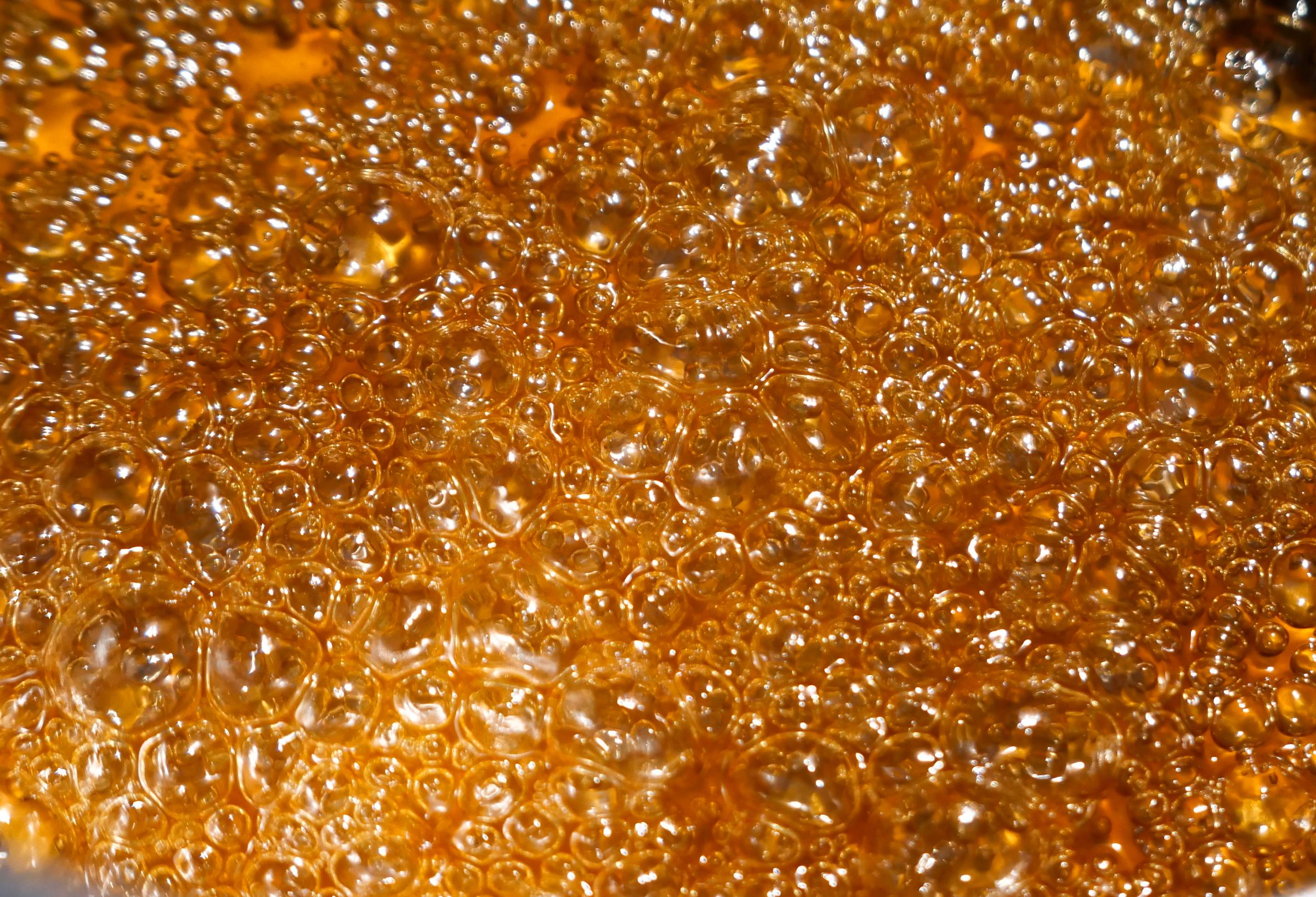 Molten caramel bubbling in the kettle
