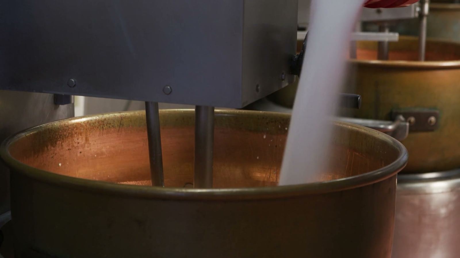 Caramel slowly cooking in a copper kettle